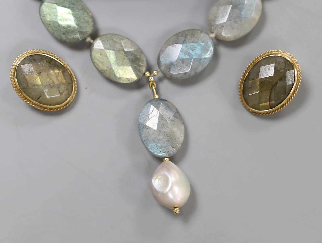 A modern 9ct mounted labradorite necklace and pair of ear clips, Opal necklace and earrings and a pair of pinch beck and amethyst set drop earrings.